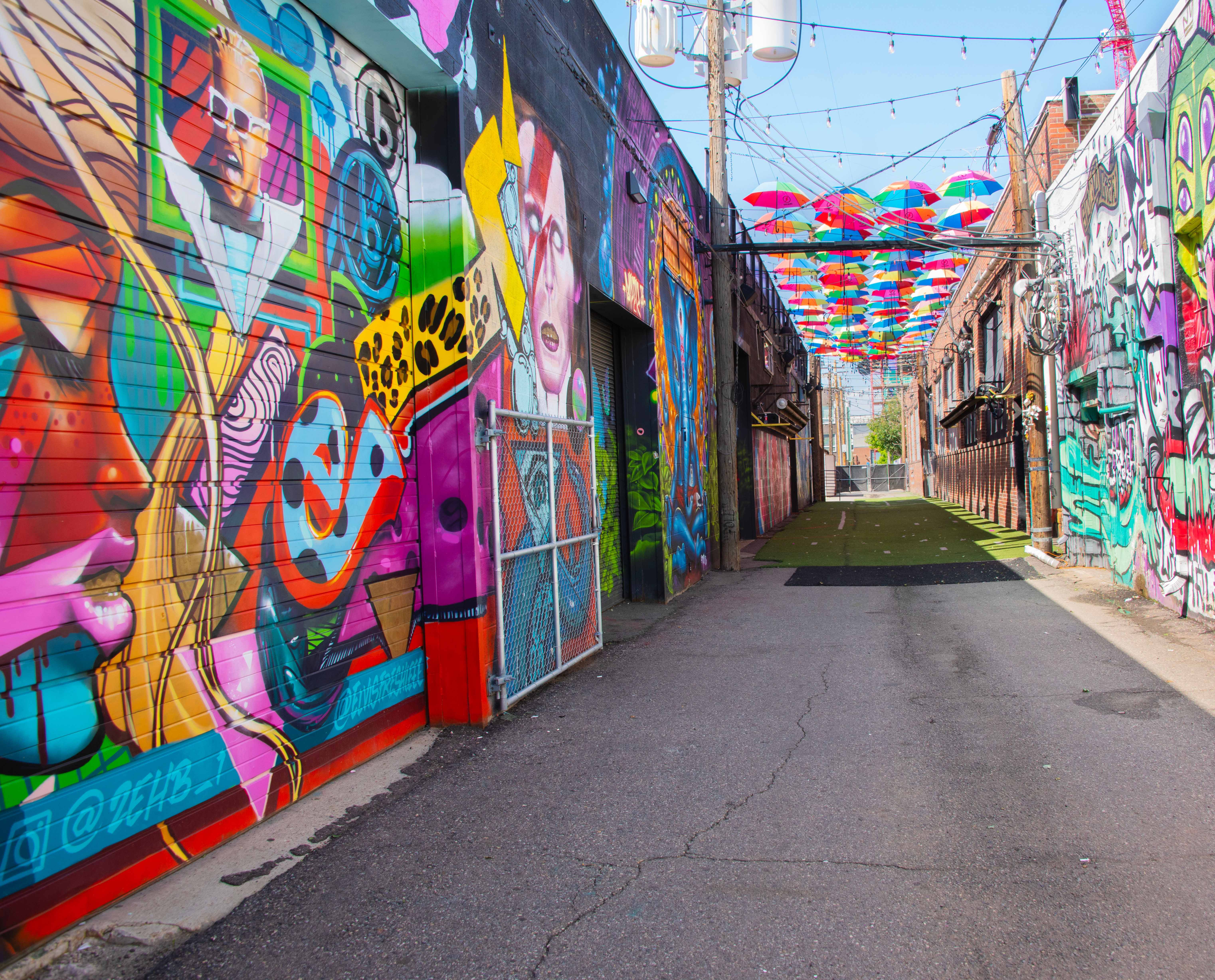 An alleyway adorned with murals in the River North neighborhood of Denver.