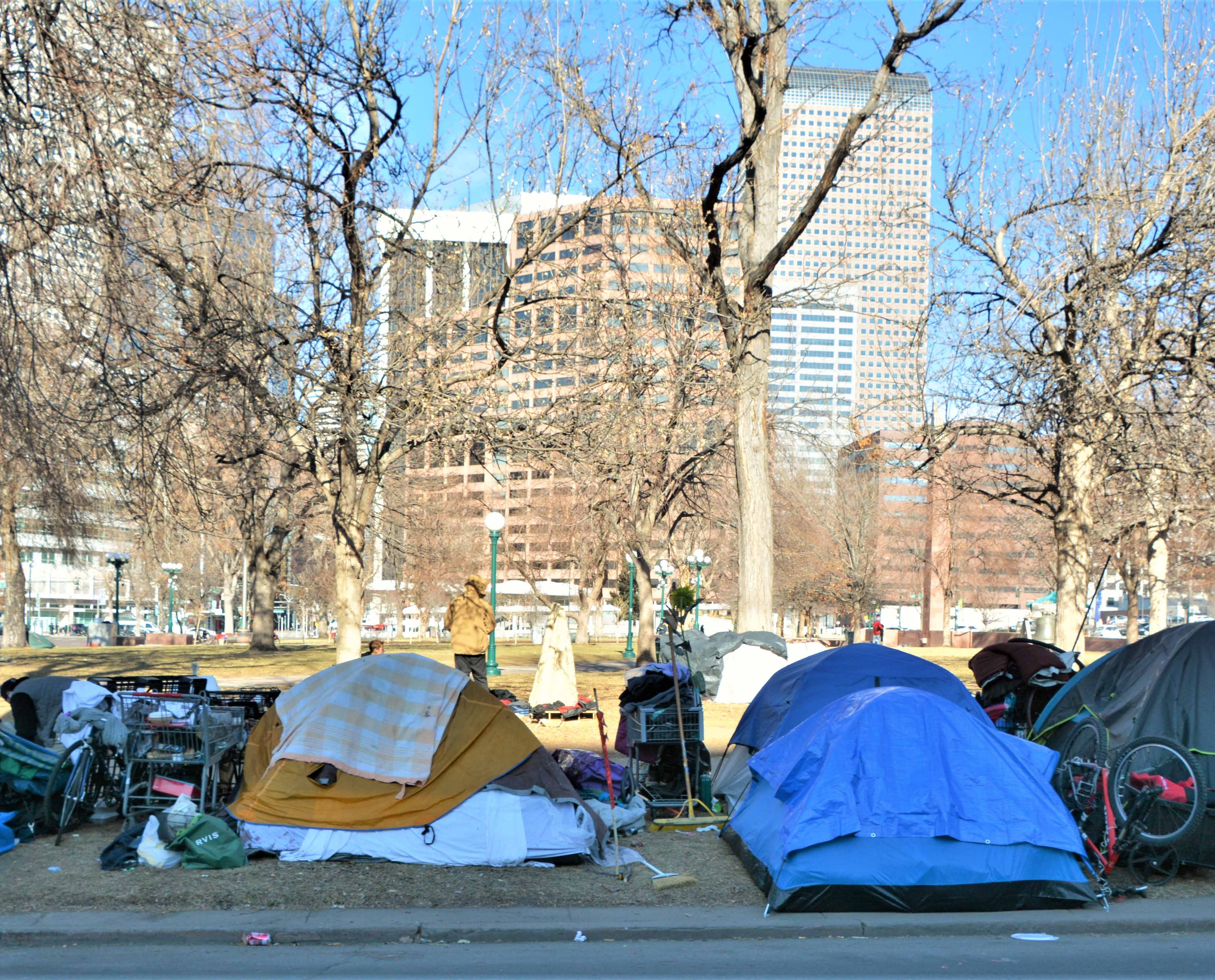 Unhoused people and their tents in downtown Denver.